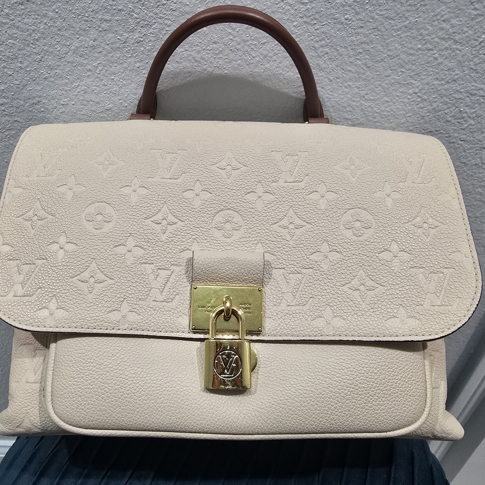 Louis Vuitton
Creme Empreinte Leather Marignan Bag